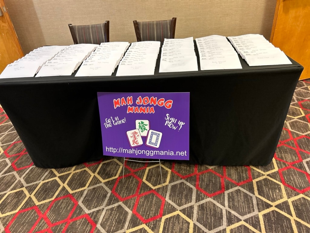 Mah Jongg Mania registration table with sign and player packets